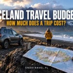 Rental car, map and volcanic Icelandic landscape on the Ring Road.
